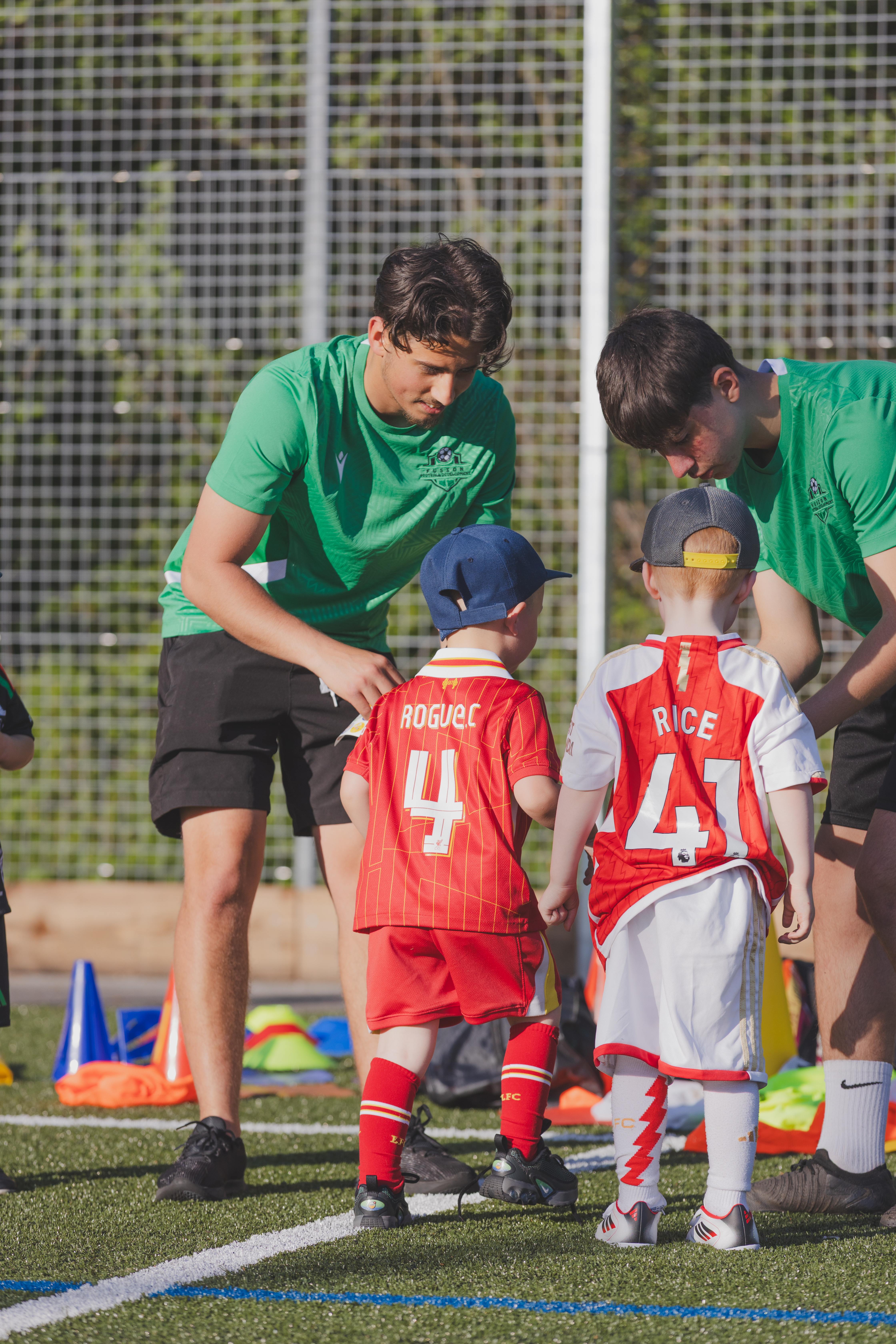 Coaches working with young children at Mini Fusions