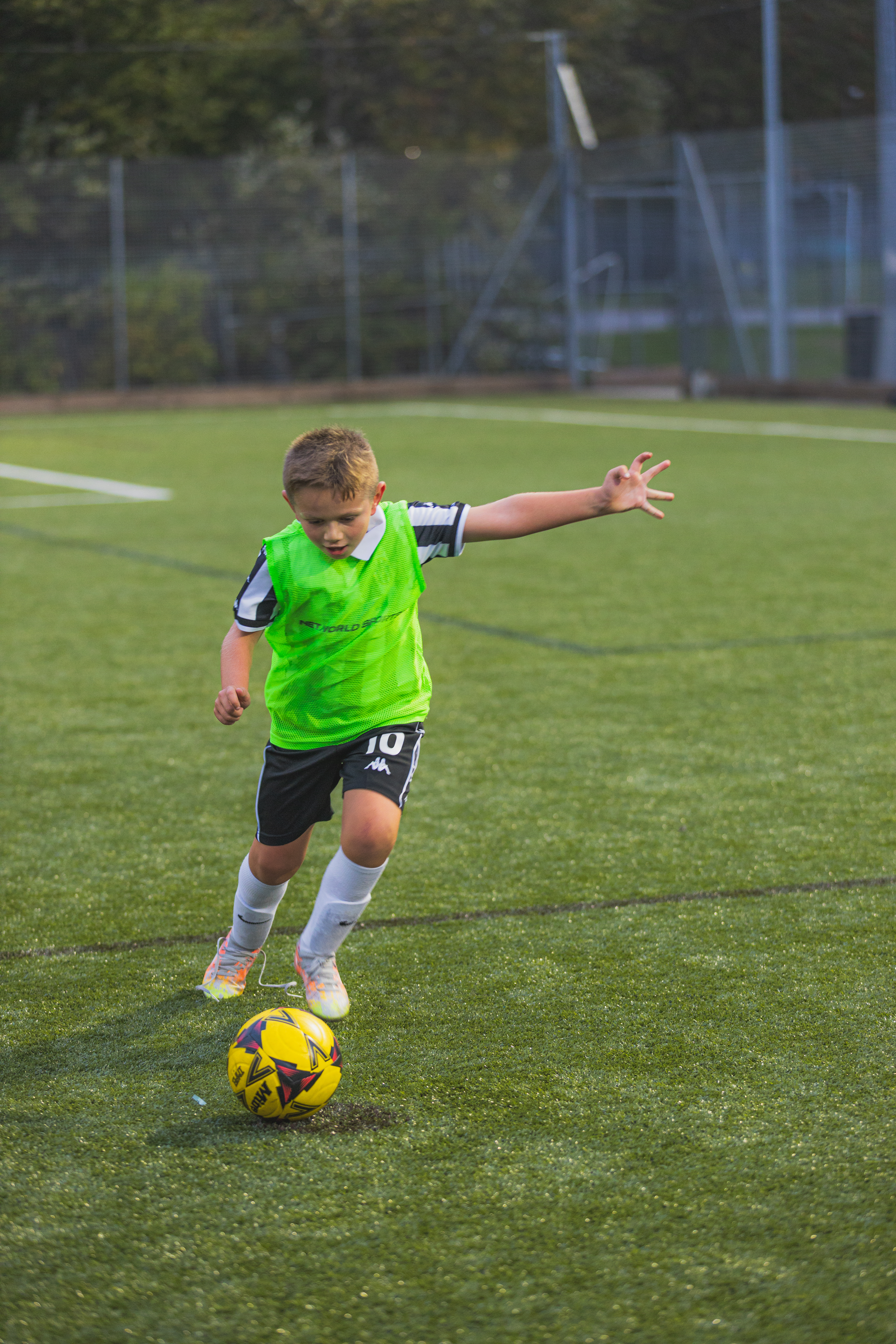 Young player dribbling with the ball