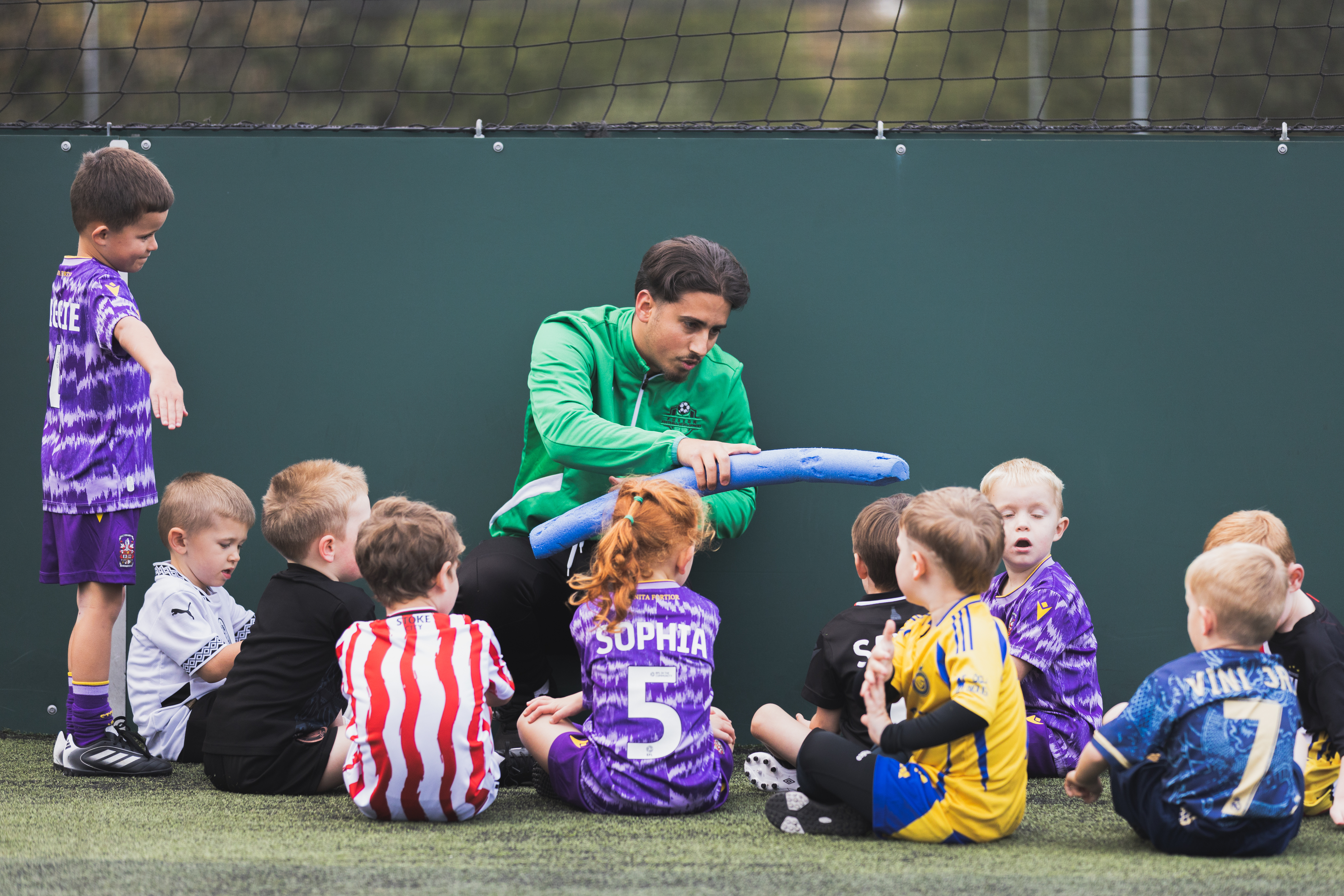 Coach working with young Fusion players